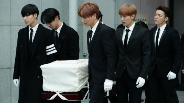 Members of pop Idol SHINee and Super Junior carry the coffin containing the body of Jonghyun of SHINee during the funeral at the hospital on December 21, 2017 in Seoul, South Korea.