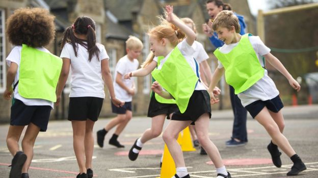 Children practising sport in school