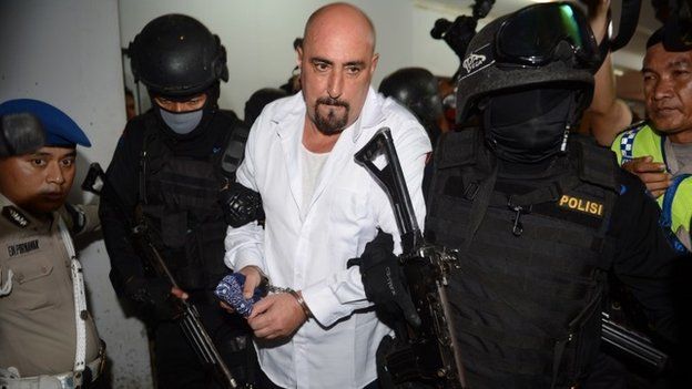 In this file photo taken on March 11, 2015, French drug trafficker and death row prisoner Serge Atlaoui (C) is escorted by armed Indonesian elite police commandos following a court hearing in Tangerang in a suburb of Jakarta where Atlaoui filed a judicial review against his death sentence.