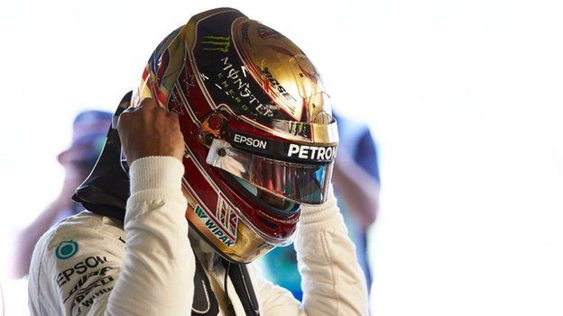 Lewis Hamilton wearing his golden helmet