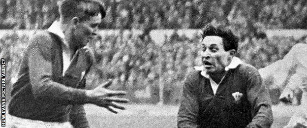 Cliff Morgan (right) in action for Wales