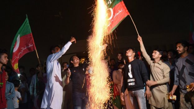 Supporters of Imran Khan celebrate in Karachi on July 27, 2018