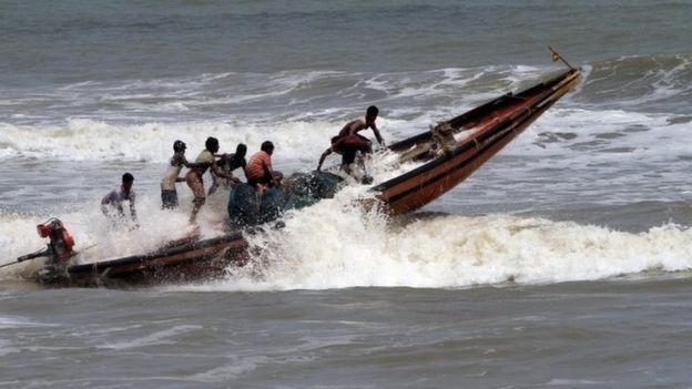 Fishermen return from the Bay of Bengal's eastern coast beach at Konark after Cyclone Fani alert