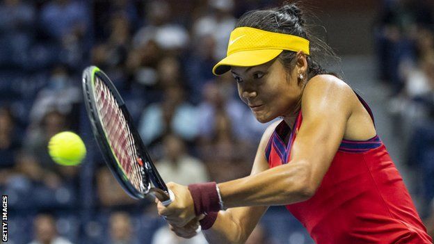 Emma Raducanu returns a ball against Maria Sakkari in the US Open semi-final