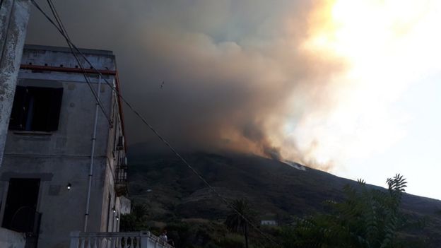 A plume of smoke rises over Stromboli