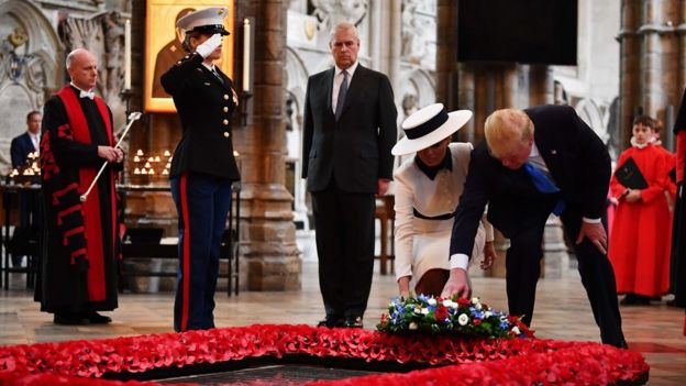 The US president and first lady laying a wreath at Westminster Abbey
