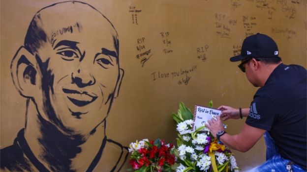 A wall covered in tributes to Kobe Bryant in Manila