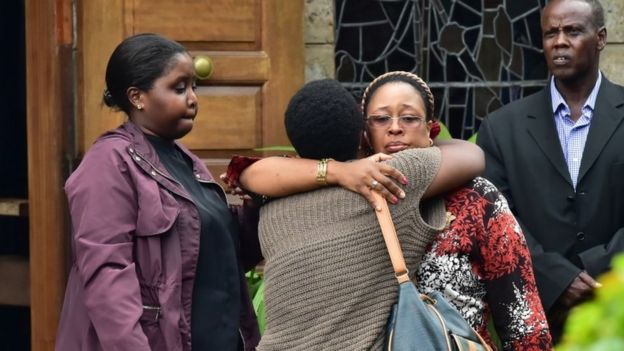 Relatives and friends consoles a family member outside the Lee Funeral Home, following the death of former Kenya"s president Daniel Arap Moi, in Nairobi on February 4, 2020.
