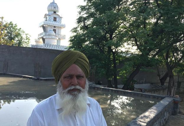 Villager Chood Singh in front of the gurdwara