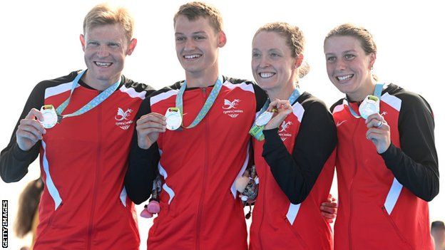 Non Stanford (second from right) with Wales team-mates Iestyn Harrett, Dominic Coy and Olivia Mathias after winning silver in the mixed team relay at the 2022 Commonwealth Games in Birmingham.