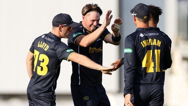 Dan Douthwaite of Glamorgan celebrates a wicket against Middlesex