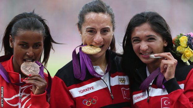 Maryam Yusuf Jamal, Asli Cakir Alptekin and Gamze Bulut pose with their Olmypic medals
