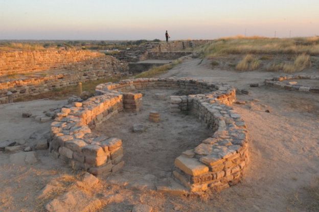 A tourist explores the ancient Dholavira archaelogical site in Kachchh district in Gujarat state on December 18, 2011