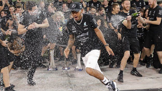 Lewis Hamilton celebrated with his Mercedes team after the Abu Dhabi Grand Prix