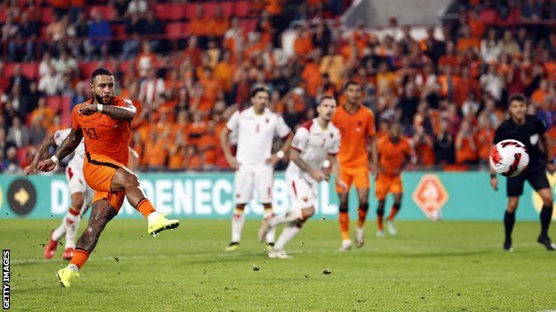 Memphis Depay scores from the penalty spot for the Netherlands against Montenegro