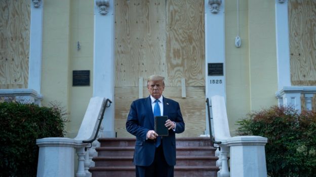 US President Donald Trump holds a Bible while visiting St John's Church across from the White House