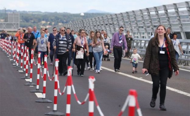 Walkers on bridge