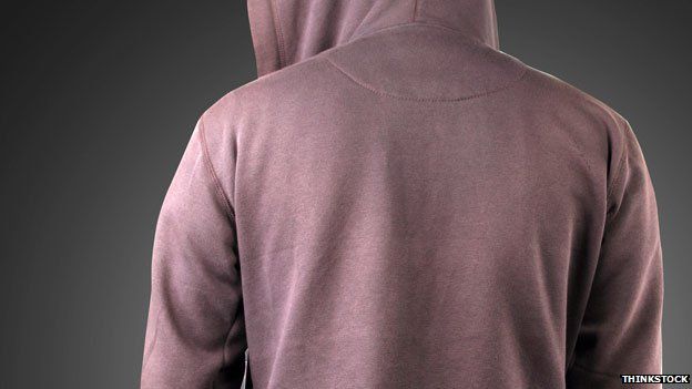 Person in hoodie photographed from behind