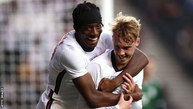 Noni Madueke (left) and Cole Palmer (right) celebrate a goal for England U21s