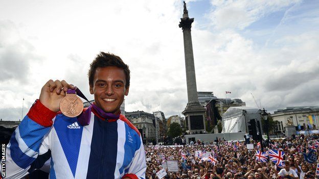 Tom Daley celebrates his bronze medal from London 2012