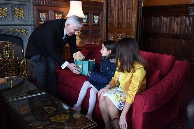 Sir Lindsay Hoyle giving Gabriella, Nazanin Zaghari-Ratcliffe's daughter, a teddy bear.