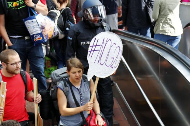 Activists arrive at Hamburg central railway station, 6 July