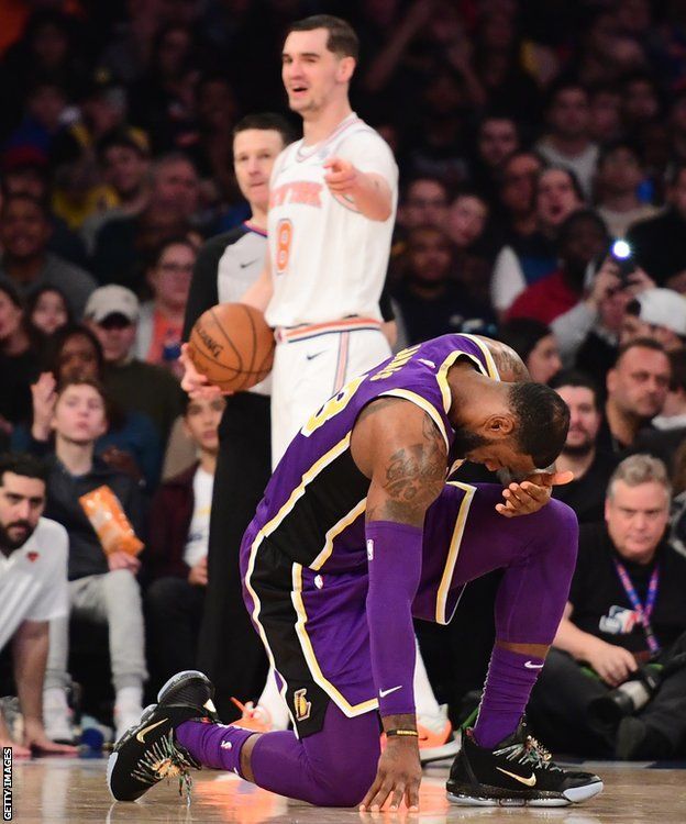 New York Knicks player Mario Hezonja points and laughs at LeBron James after fouling the Los Angeles Lakers forward