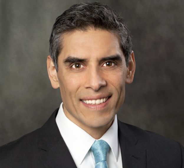 A head and shoulders picture of Jihad Shoshara, smiling and wearing a suit and tie