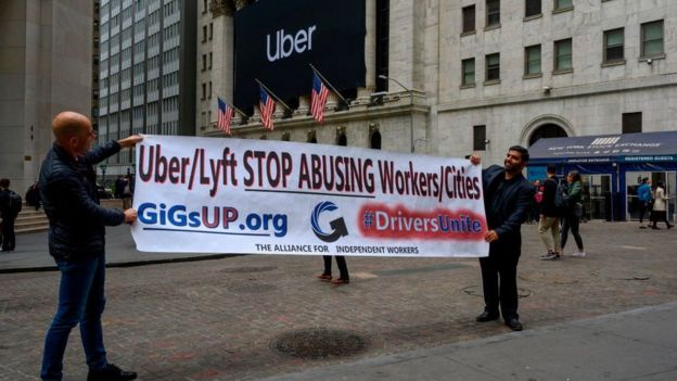 Protesta frente a Wall Street contra el trato de las empresas de transporte compartido con sus empleados