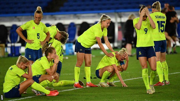 Sweden's players react after losing the penalty shootout of the Tokyo 2020 Olympic Games final to Canada