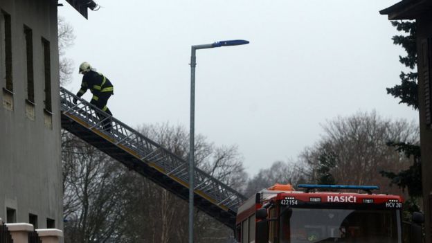 A firefighter climbs with a ladder into a home for people with learning disabilities