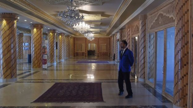 March 7, 2018 shows a bellboy standing at a hall of the Intercontinental Hotel in Kabul.