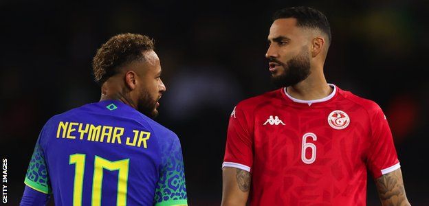 Neymar and Dylan Bronn in action during the friendly between Brazil and Tunisia