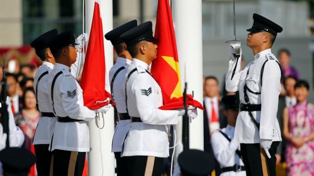 The flags of China and Hong Kong are raised during a ceremony marking the 20th anniversary of the city's handover from British to Chinese rule, in Hong Kong, 1 July 2017