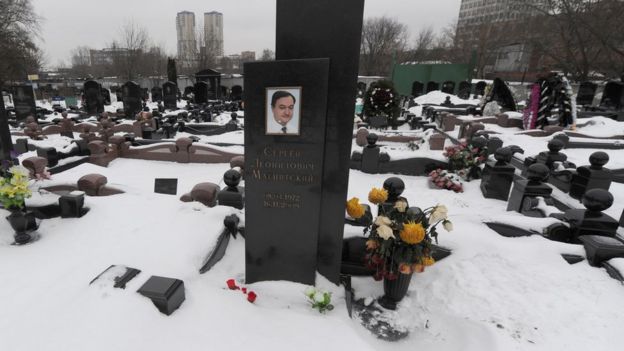 A picture taken on December 7, 2012, shows the snow-clad grave of Russian lawyer Sergei Magnitsky at the Preobrazhenskoye cemetery in Moscow.