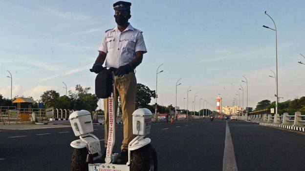 A traffic police officer rides a self-balancing scooter during the lockdown in Chennai on May 15, 2020