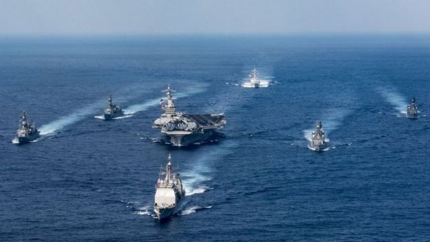 The Carl Vinson being escorted by other warships