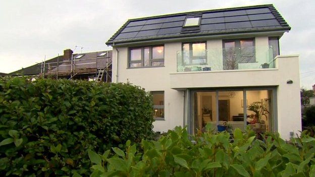 The front of a a house which costs just £15 ($23) per year to heat, light and power