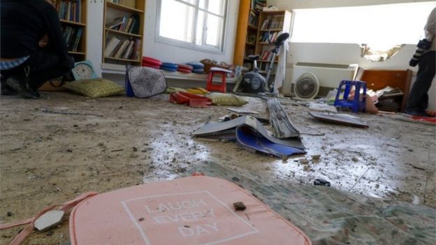 Objects are scattered in a house that was hit by a rocket fired from the Gaza strip in the southern Israeli village of Netiv Haasara