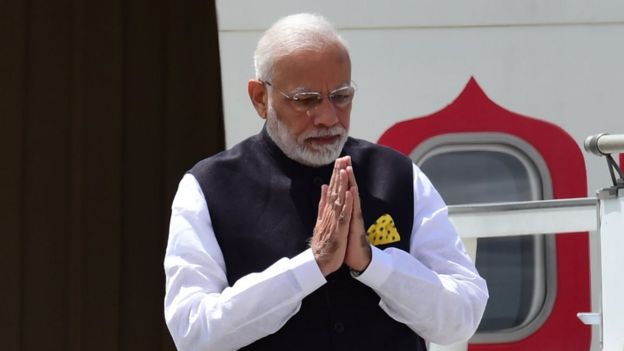 India's Narendra Modi steps off his plane upon arrival in Buenos Aires on 29 November