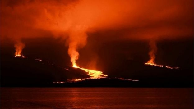 Handout picture released by the Galapagos National Park press service showing lava flowing down the Sierra Negra volcano on Isabela Island in the Galapagos Archipelago about 1000 km off the Ecuadorean coast in the Pacific Ocean, early on June 27, 2018.