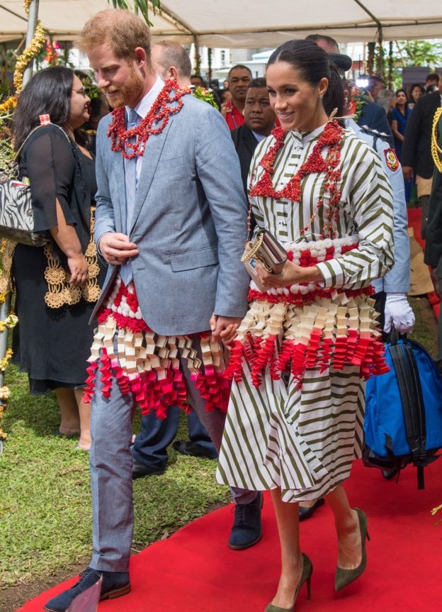 Prince Harry and Meghan at an exhibition of Tongan handicrafts