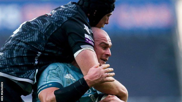 Leinster's Rhys Ruddock is tackled by Adam Beard of Ospreys