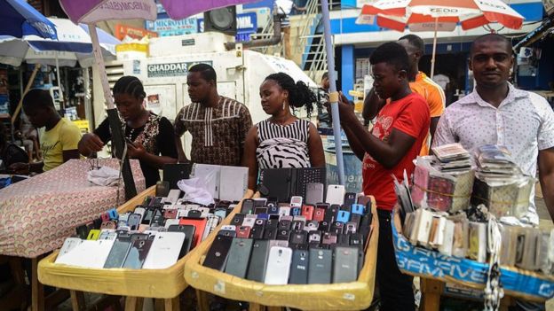 Nigerians are seen at the 'Computer Village', the bazaar where electronic products such as mobile phones, computer hardware and accessories are sold, in the Ikeja suburb of Lagos, Nigeria on February 24, 2015