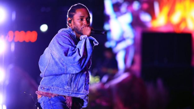 Kendrick Lamar performing on stage