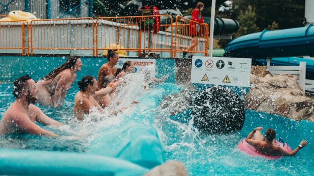 People enjoy an earlier swimming event organised by British Naturism