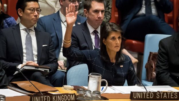 Nikki Haley, United States ambassador to the United Nations, raises her hand as she votes yes to levy new sanctions on North Korea designed to curb their nuclear ambitions during a meeting of the United Nations Security Council concerning North Korea at UN headquarters, 11 September 2017 in New York City.