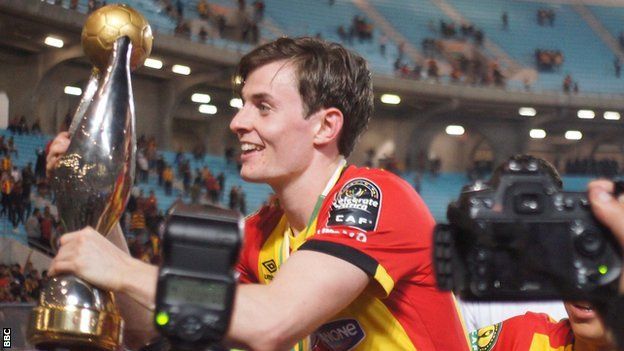Ayman Ben Mohamed shows off the African Champions League trophy to Esperance fans