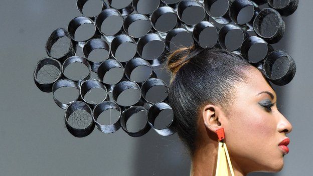 A model presents a creation by Ivorian hairstylist Dieudonne Senato during the 10th Afrik fashion show in Abidjan over the weekend of 13 and 14 June 2015