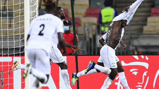 Alhadji Kamara wheels away in celebration after equalising against Ivory Coast